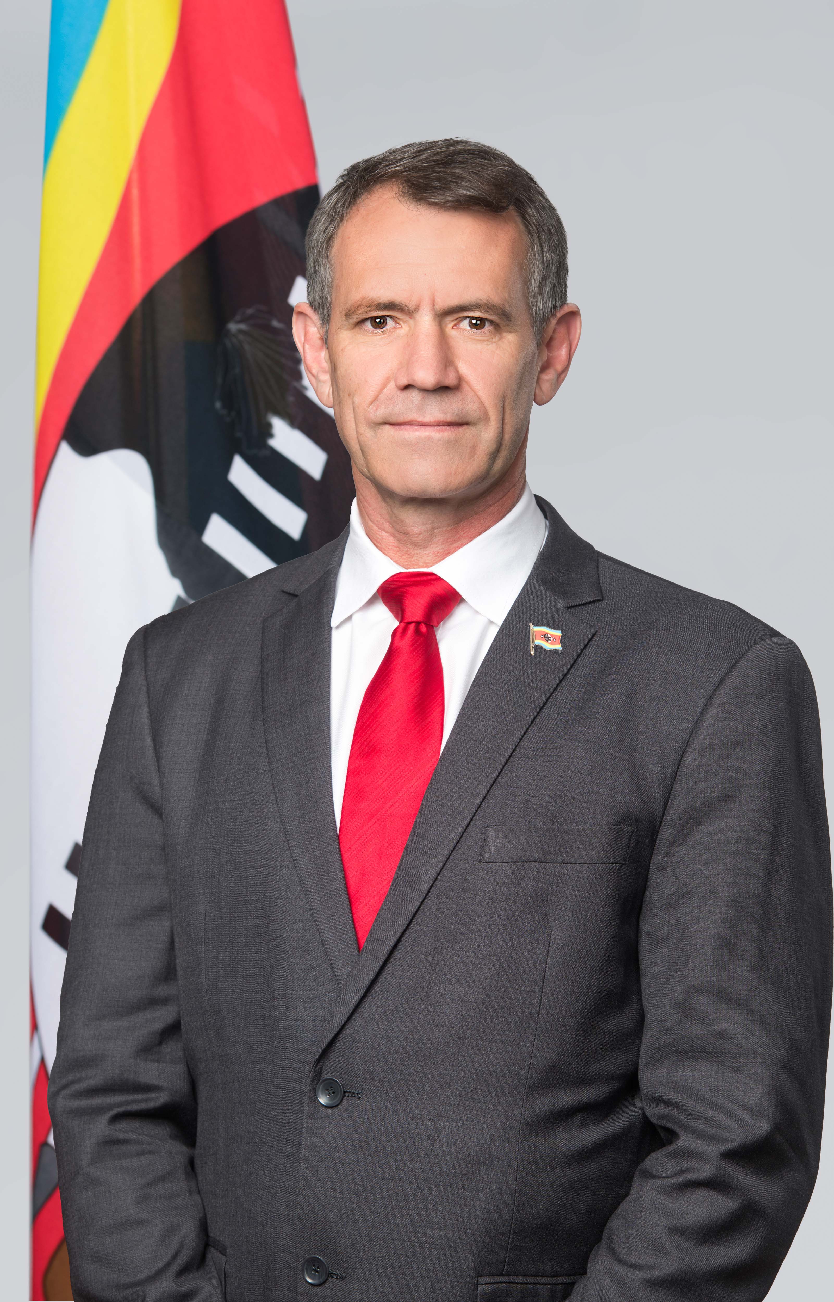 Minister of Finance Neal Rijkenbergwith Flag Pin