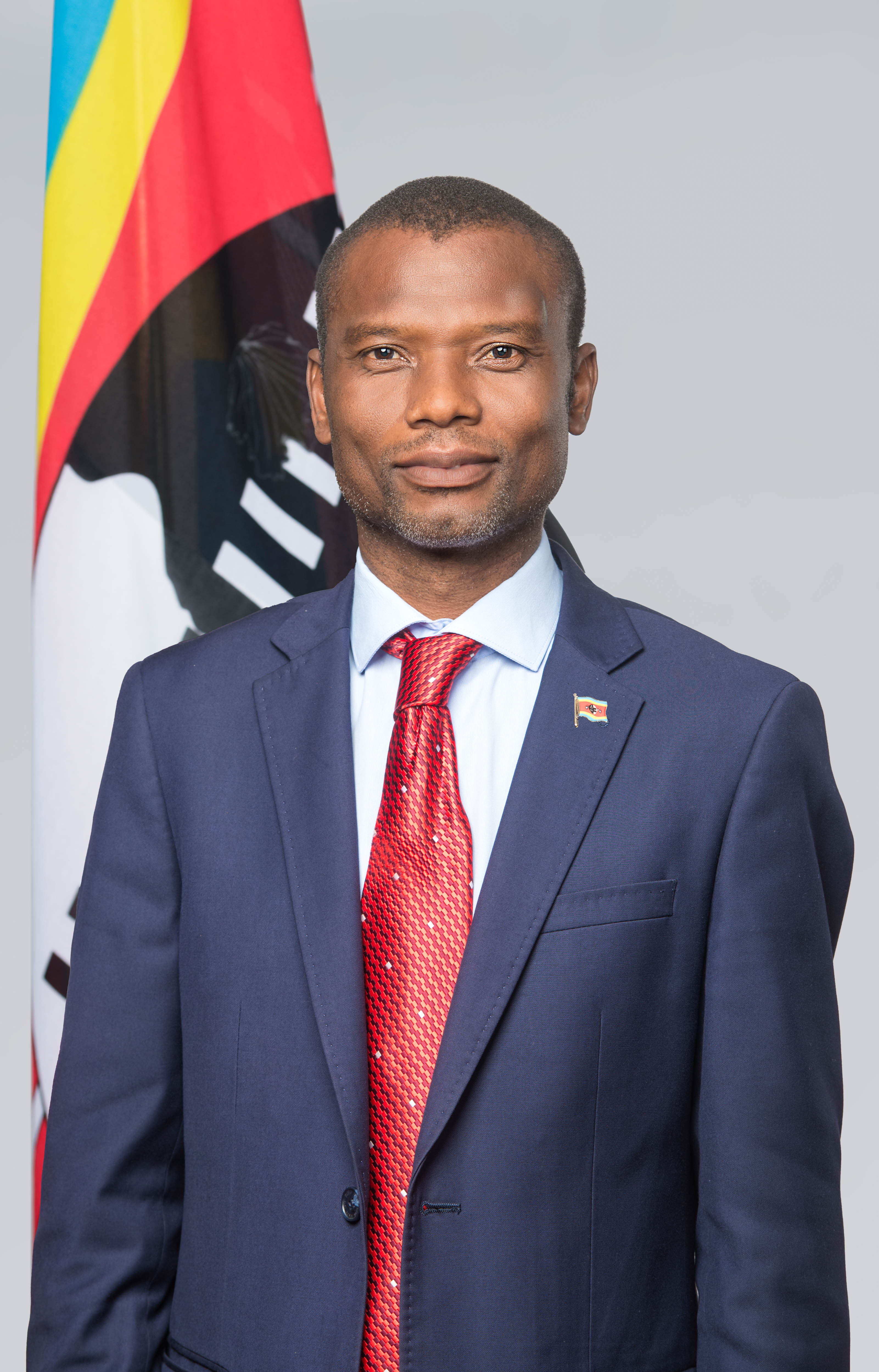 Minister of Housing Appolo Maphalala with Flag Pin